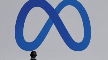 Ilustrasi logo Meta, nama baru induk Facebook, WhatsApp, dan Instagram.(Reuters/ Carlos Barria)