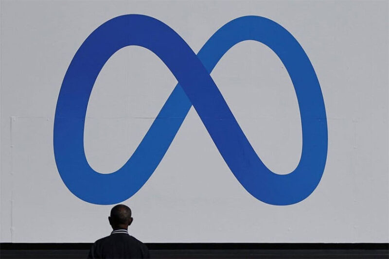 Ilustrasi logo Meta, nama baru induk Facebook, WhatsApp, dan Instagram.(Reuters/ Carlos Barria)