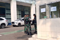 Kantor Badan Gizi Nasional (BGN) yang berlokasi di kawasan Kebon Sirih, Jakarta Pusat, dijaga ketat aparat dari Tentara Nasional Indonesia (TNI) usai pencopotan Dadan Hindayana sebagai Kepala BGN, Rabu (3/6/2026).(KOMPAS.com/FIRDA JANATI)